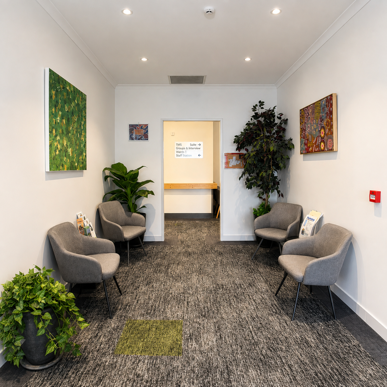 Essendon Private Clinic reception waiting area with chairs, artwork and indoor plants
